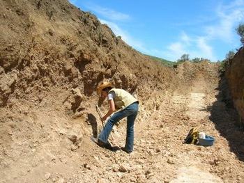 Out in the field, soil sample taking.